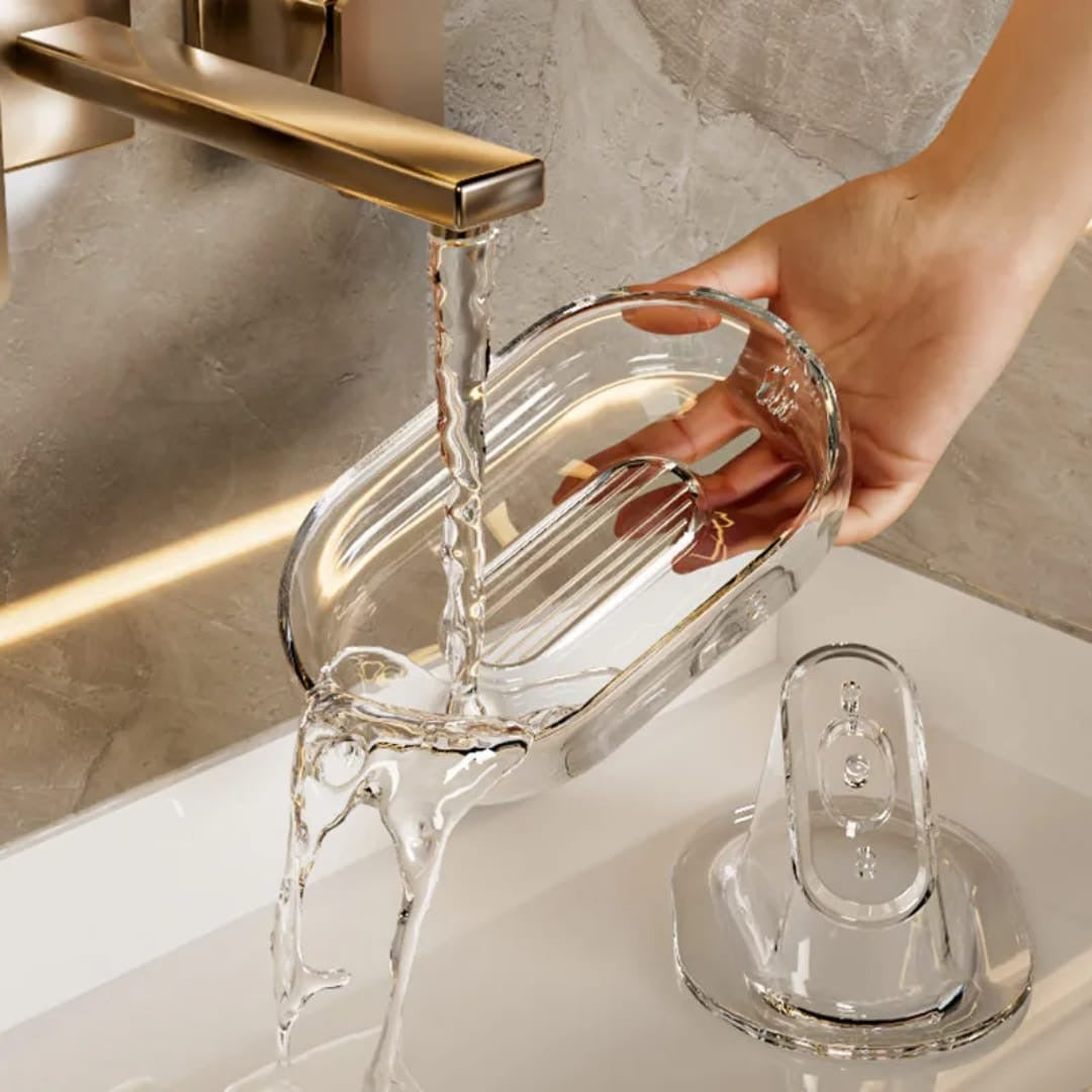 Sloped drain transparent soap dish.