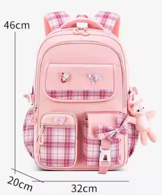 Checkered Student Backpack with plushie and pins.