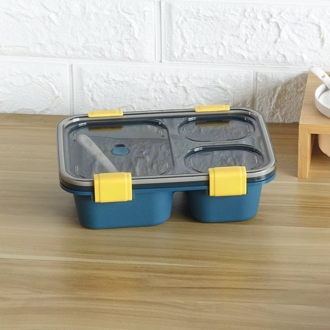 Partioned lunch/snack box with a spoon