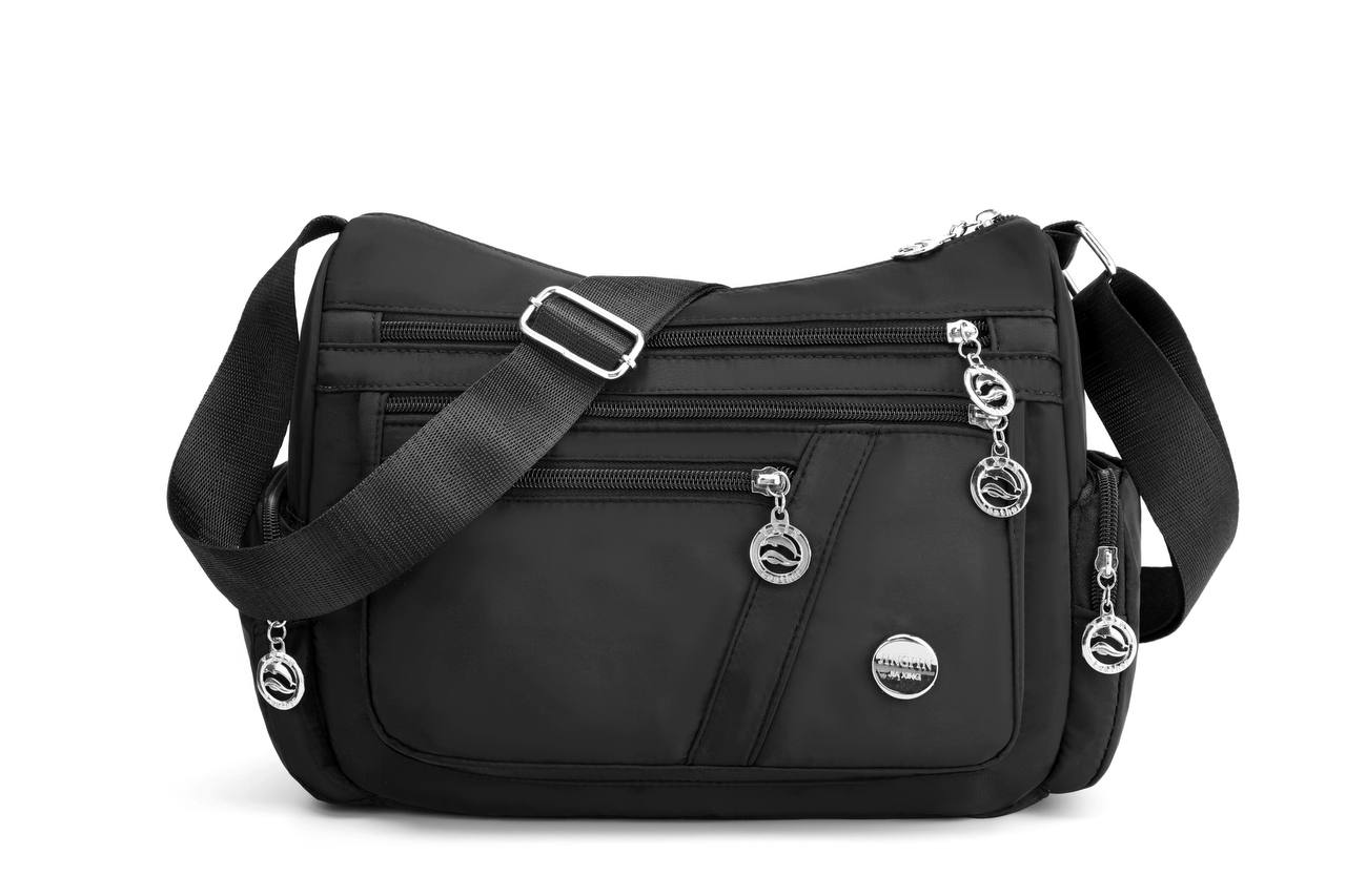 Multi-comnartment cross body bag