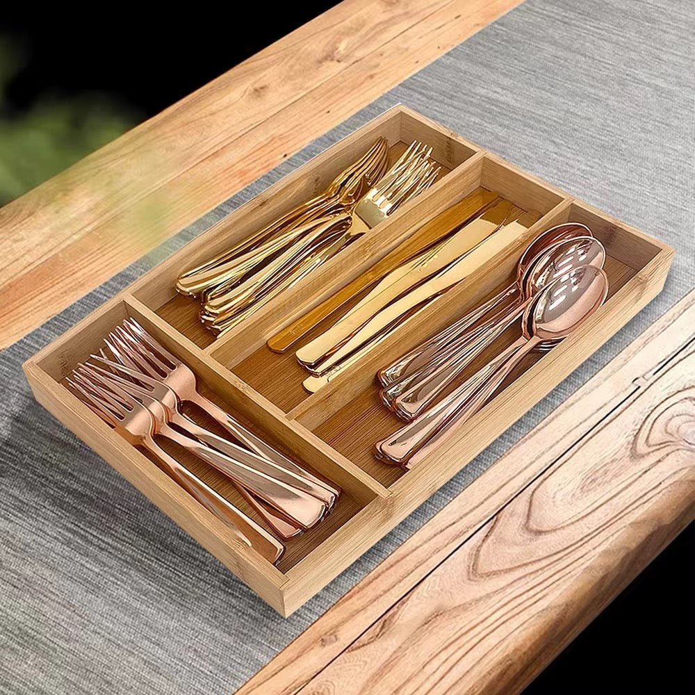 Bamboo kitchen drawer cutlery organizer with partitioned compartments for sorting silverware.