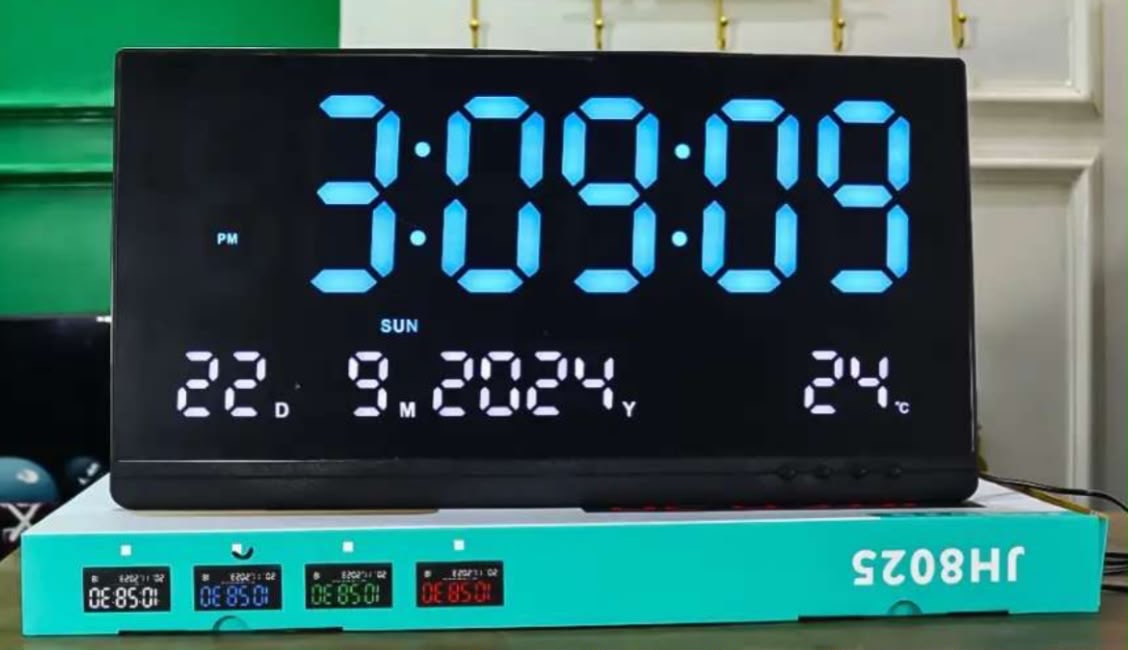 large LED digital wall clock (Model JH8025) with a calendar and temperature