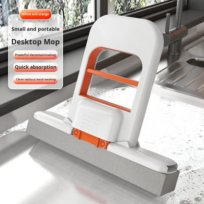 One-hand squeeze handle foldable desktop mop for indoor cleaning.