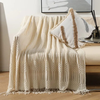 knited throw blanket 
with tassels