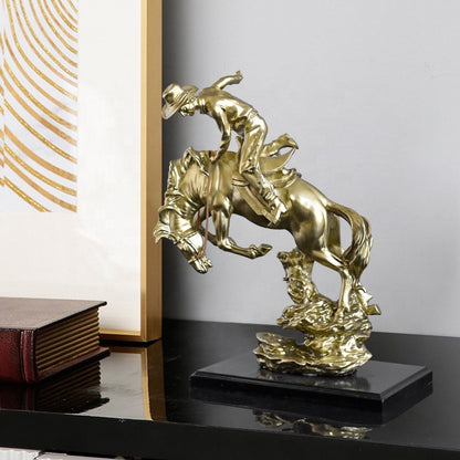 COWBOY RIDING HORSE STATUE