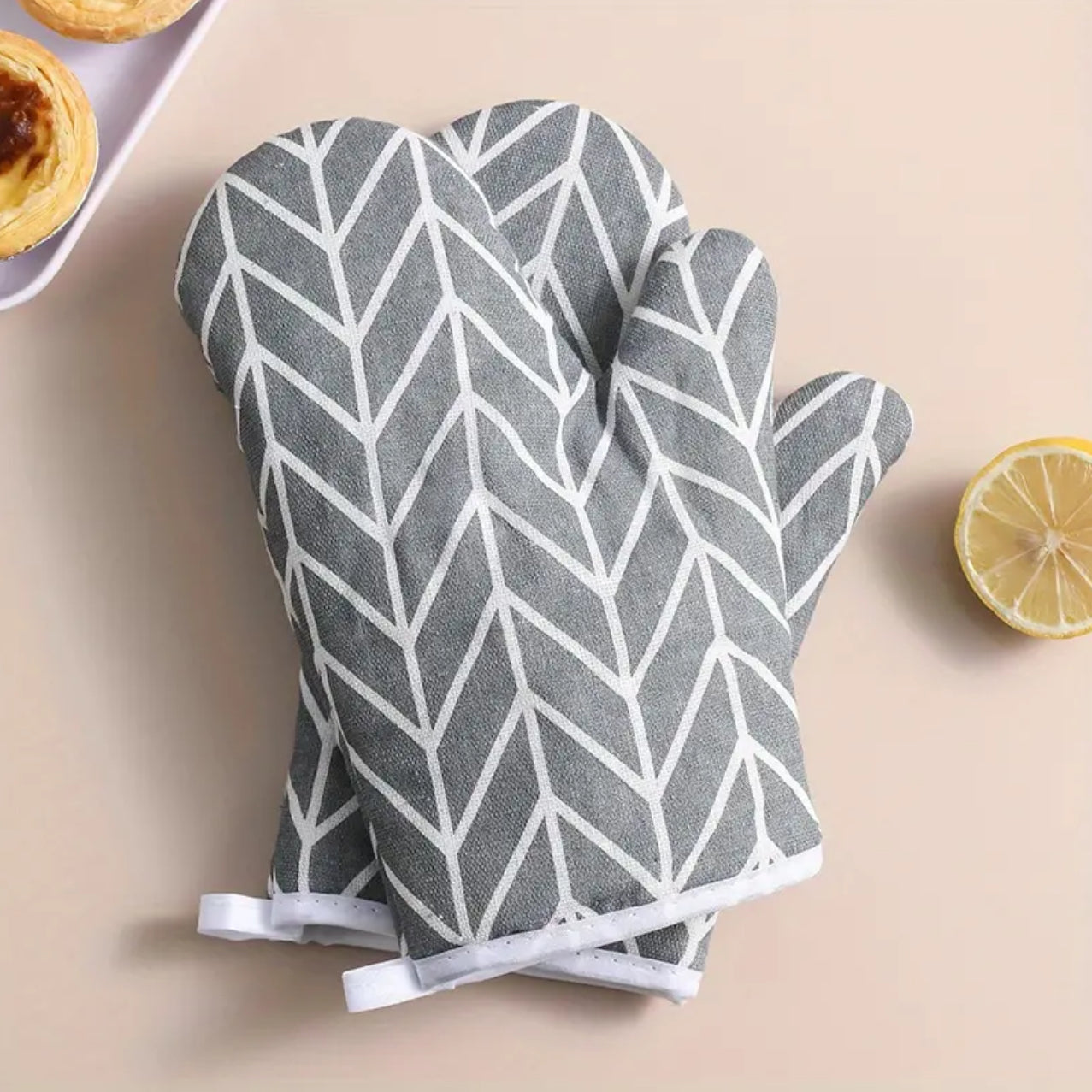 A pair of cotton oven gloves