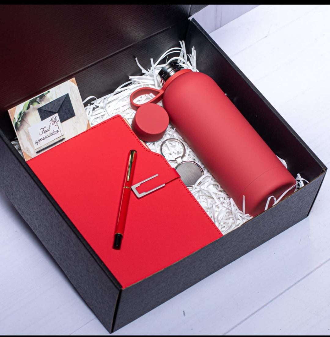 Executive 4 in 1 gift set
Thermal insulated Flask-500 mls
Notebook 
Executive signature pen 
Key holder