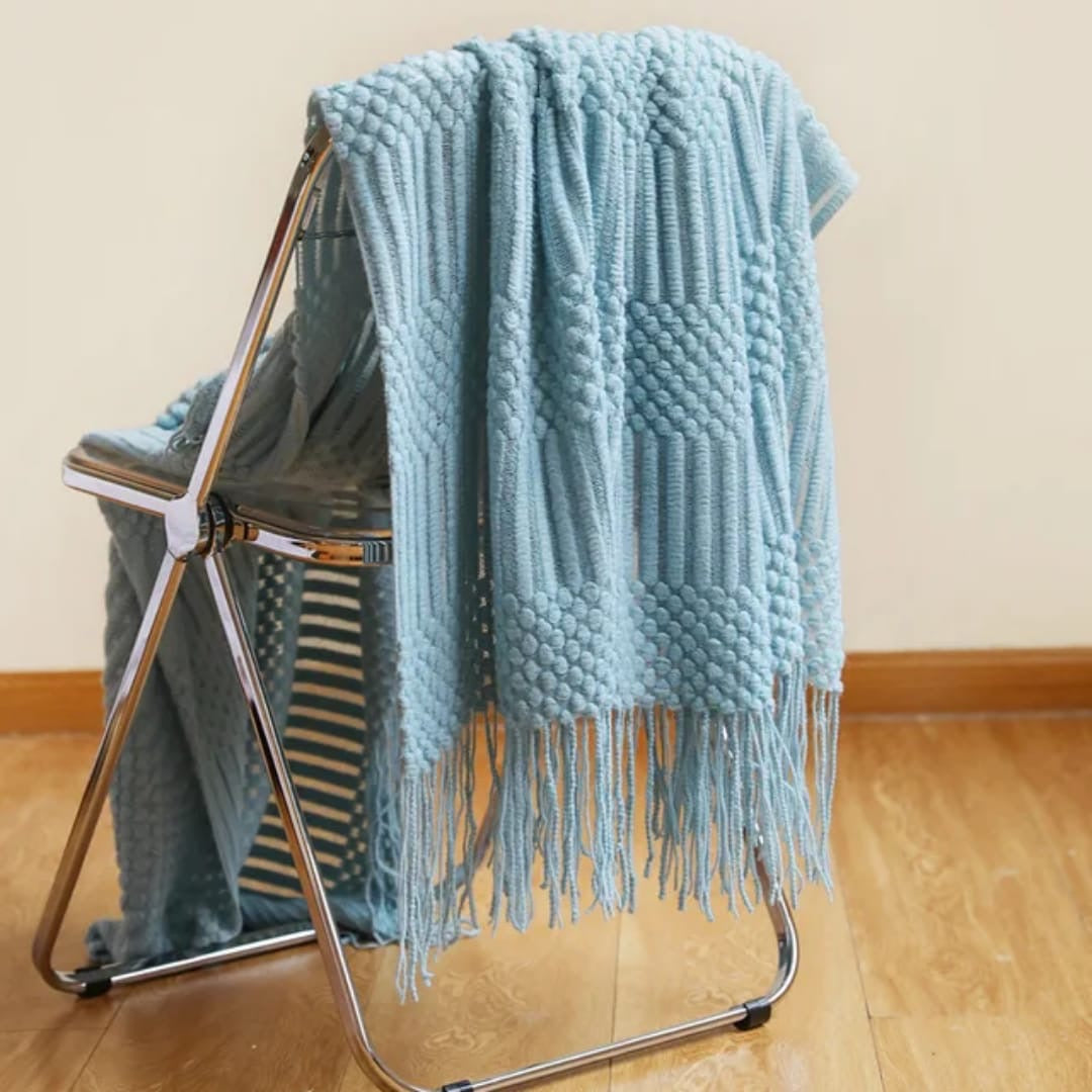 knited throw blanket 
with tassels