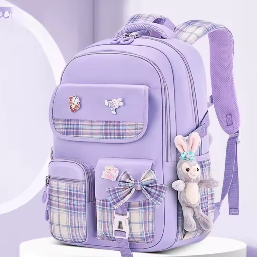 Checkered Student Backpack with plushie and pins.