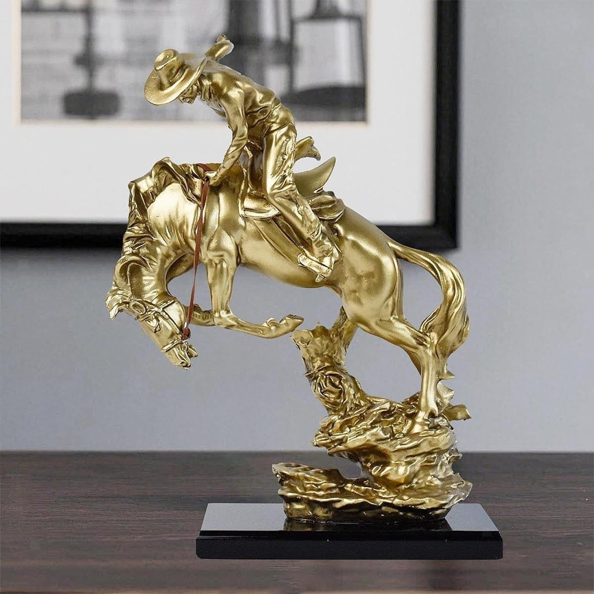 COWBOY RIDING HORSE STATUE