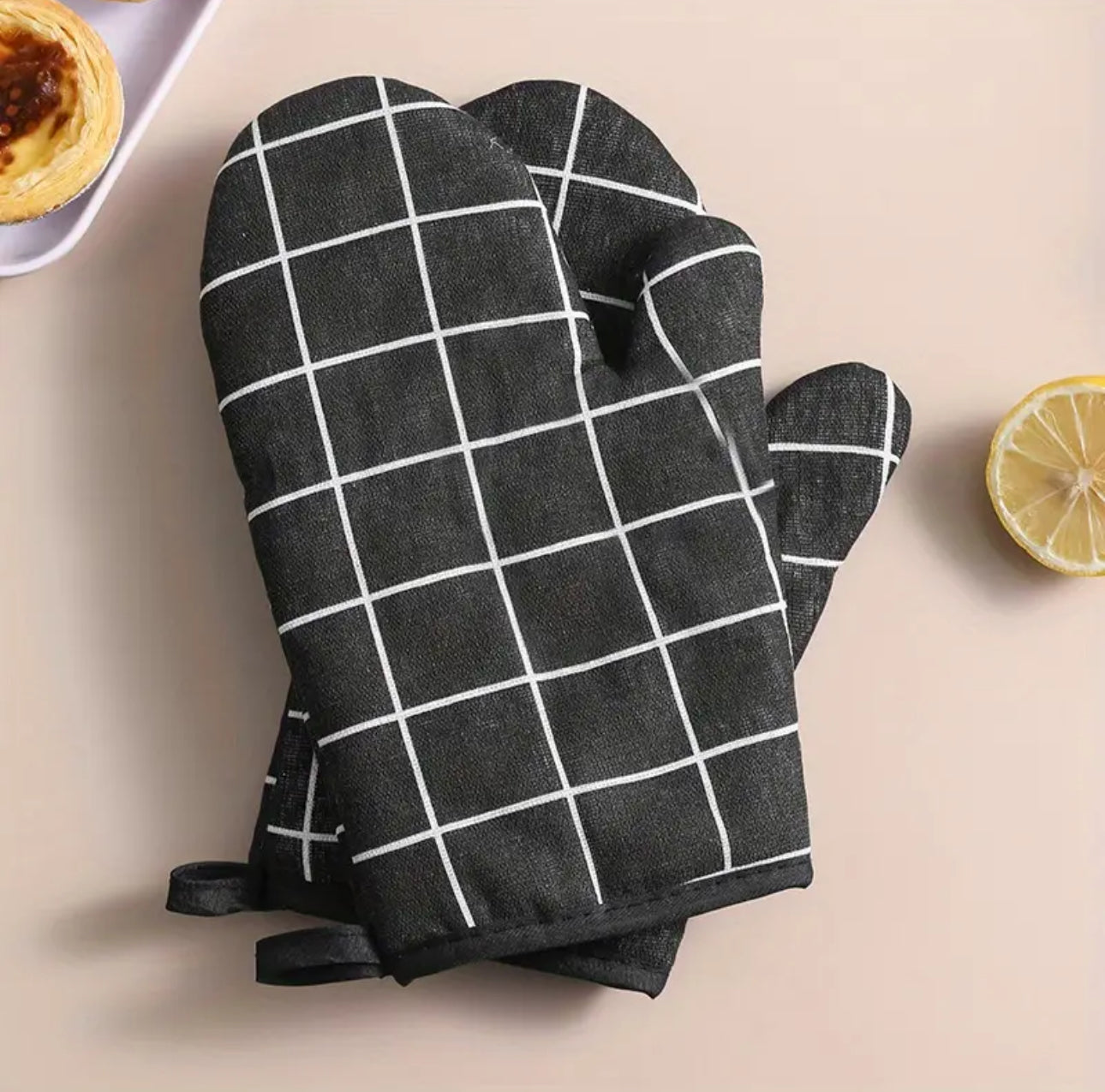 A pair of cotton oven gloves