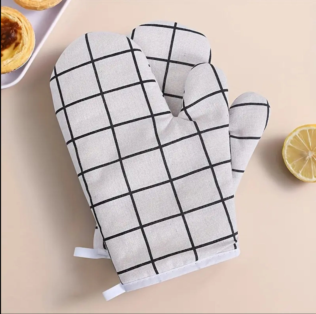 A pair of cotton oven gloves