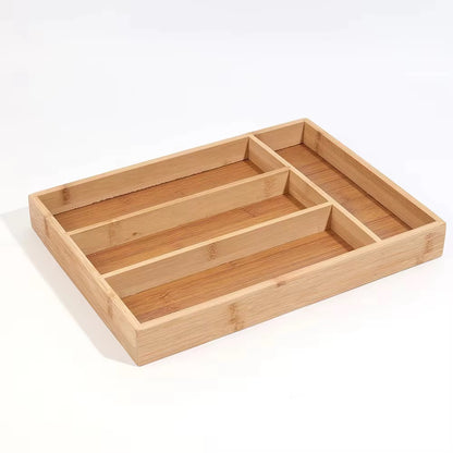 Bamboo kitchen drawer cutlery organizer with partitioned compartments for sorting silverware.