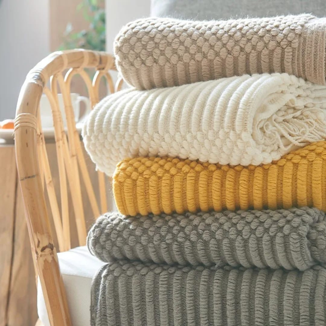 knited throw blanket 
with tassels