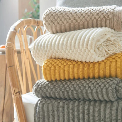 knited throw blanket 
with tassels