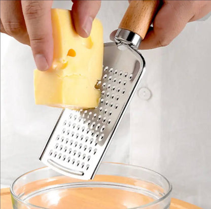 Stainless steel multipurpose grater 
With wooden handle