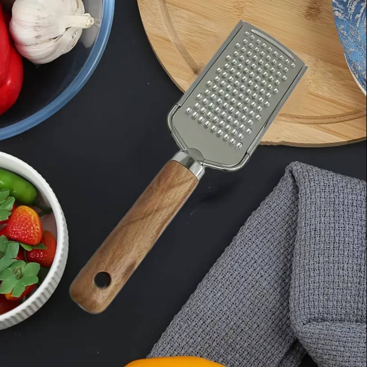 Stainless steel multipurpose grater 
With wooden handle