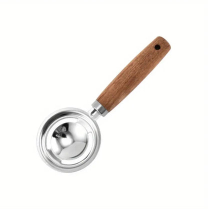 Stainless kitchen accessories with wooden handles.