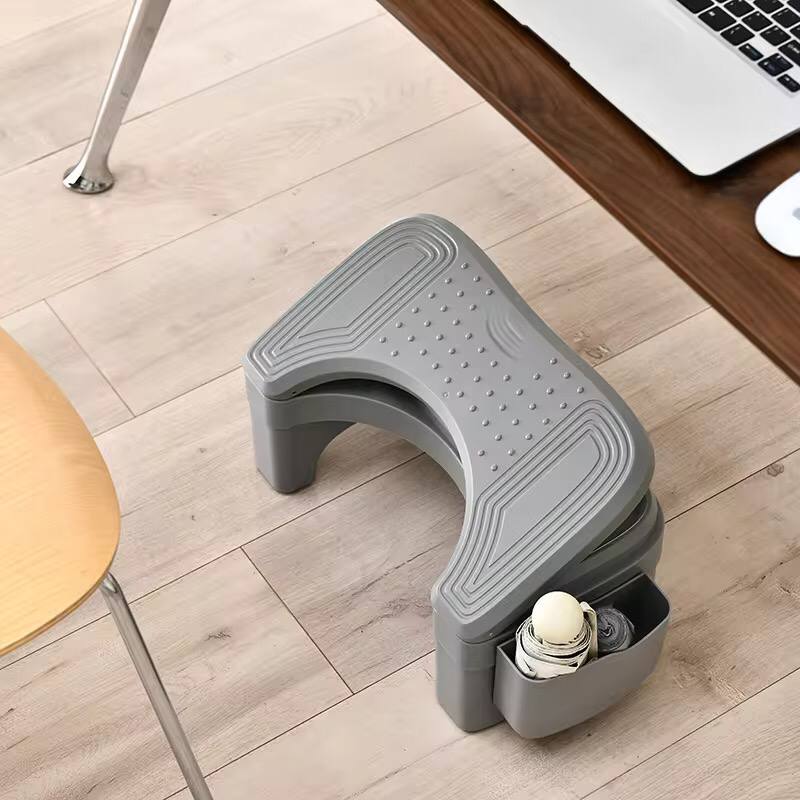 Ergonomic foldable / adjustable footrest with storage space