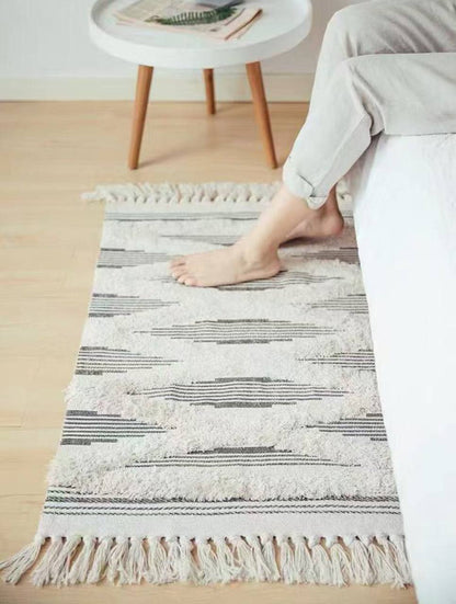 Bohemian Nordic style bedroom rug with tassels