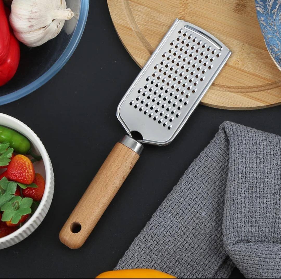 Stainless steel multipurpose grater 
With wooden handle