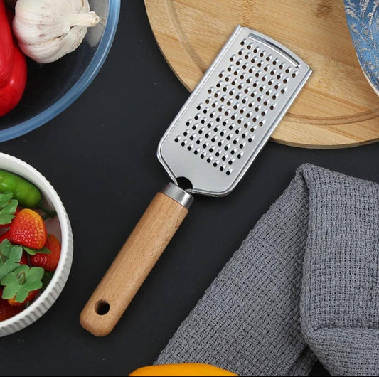 Stainless steel multipurpose grater 
With wooden handle