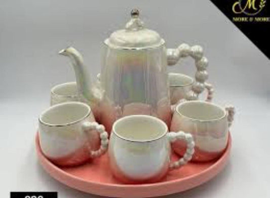 Fine ceramic 8pc Rotating tray tea set with 6 cups and kettle