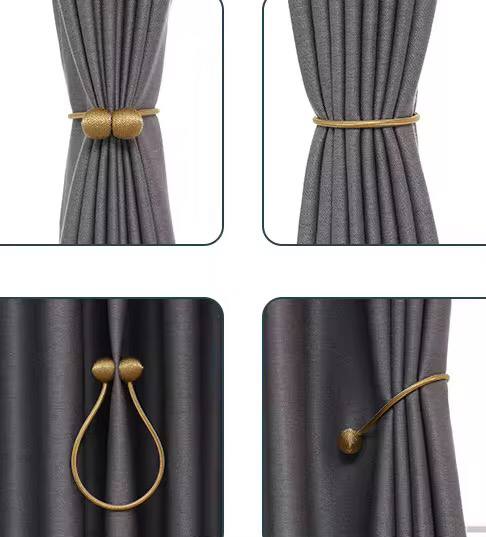Magnetic curtain holders 
A pair