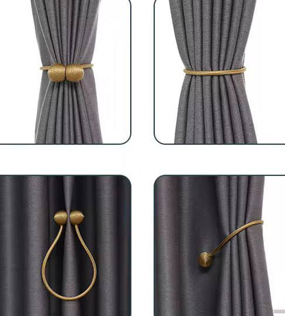 Magnetic curtain holders 
A pair