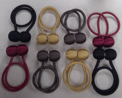 Magnetic curtain holders 
A pair