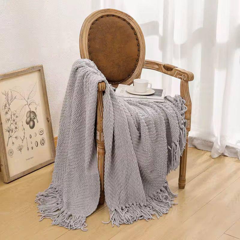 Textured knitted heavy throw blanket with tassels