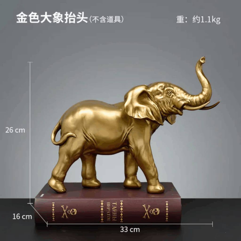 GOLDEN ELEPHANT FIGURINE A RAISED TRUNK