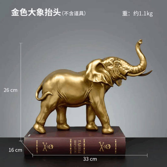 GOLDEN ELEPHANT FIGURINE A RAISED TRUNK